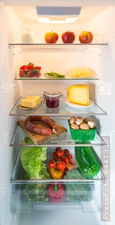 Open fridge filled with food.