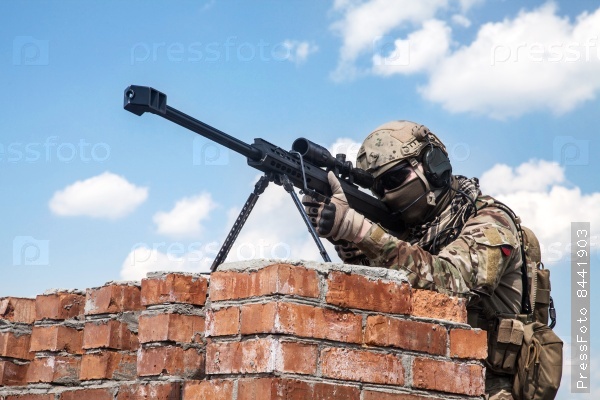 US Army ranger sniper with huge rifle, stock photo
