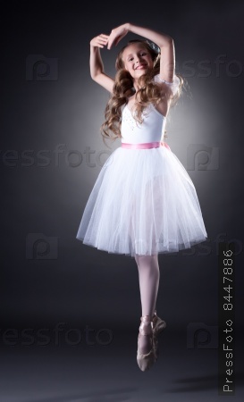 Emotional young ballet dancer posing in jump