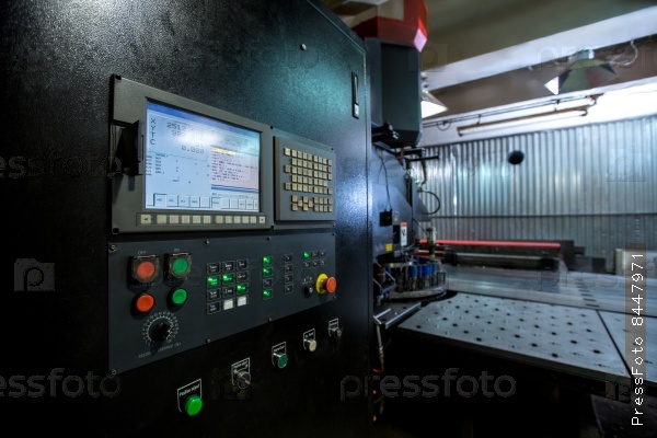 Punching machine. Foreground of control panel