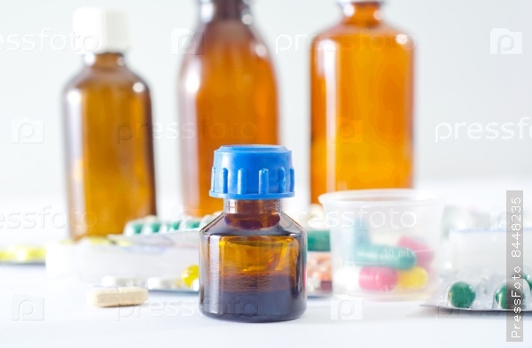 Color pills and medical bottle, stock photo