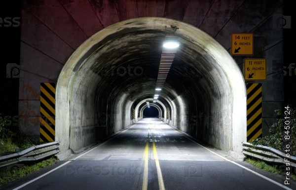 Journey into the long dark tunnel on highway 101 late at night traveling