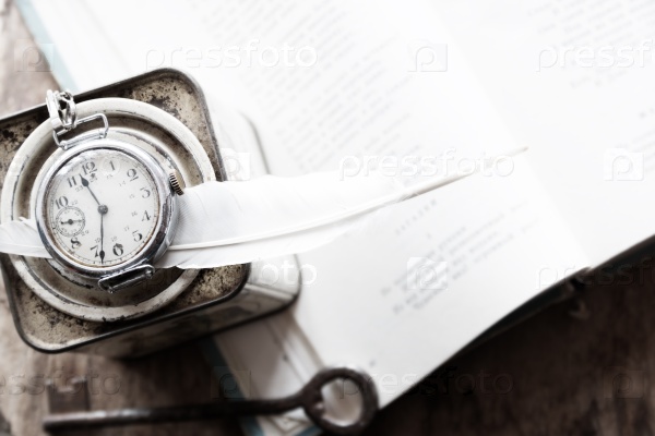 Poetry, poet, writing poems, time idea. Books, poems and feather. Soft Focus, Toned. Vintage.