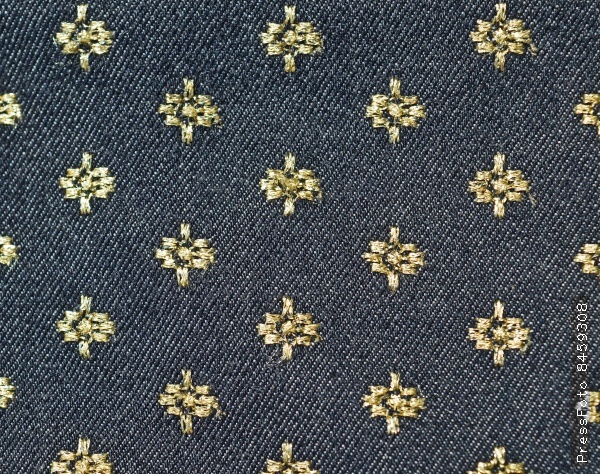 Gold and black floral fabric background