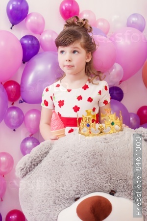 Image of amusing little girl with big teddy bear