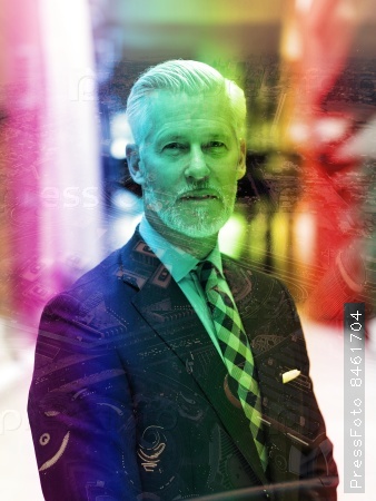Double exposure design. Portrait of senior business man with grey beard and hair alone i modern office indoors