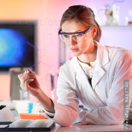 Life science researcher working in laboratory. Portrait of a confident female health care professional in his working environment reviewing structural chemical formula written on a glass board.