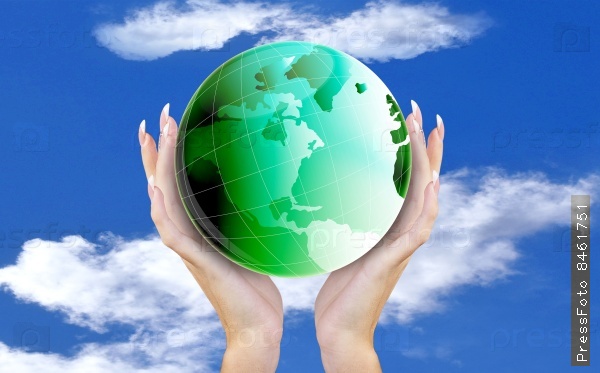 Green Globe Planet Earth in Hands Woman on blue sky background
