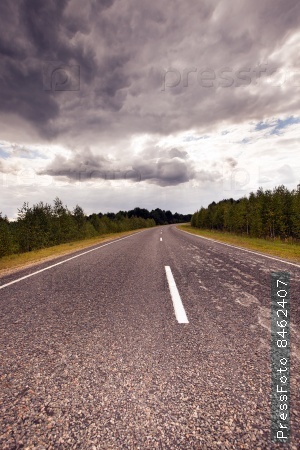 the asphalted road to time of storm weather. Belarus
