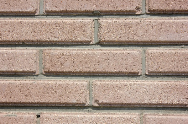 House wall element from a brown brick