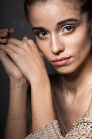 beautiful fashion model wearing hanging beige blouse closeup portrait