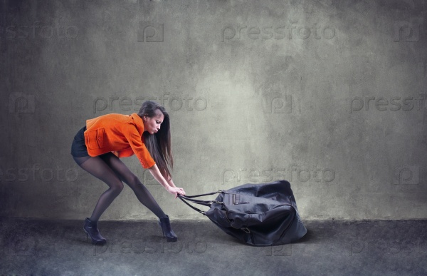 Woman carrying heavy bag