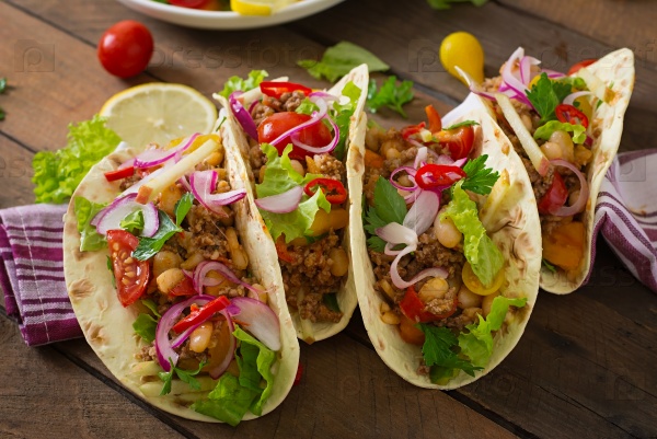 Mexican tacos with meat, beans and salsa, stock photo