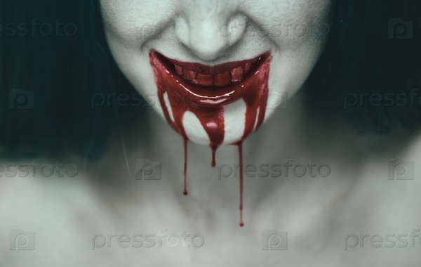 Spooky woman smiling, mouth of woman in blood. Halloween or horror theme