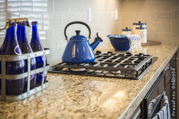 Beautiful Marble Kitchen Counter and Stove With Cobalt Blue Decor