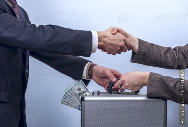 Woman in suit giving metal briefcase with dollars to man. Man and woman shaking each other by the hand. Conception of safe storage and protection of cash. Financial theme. Horizontal view, stock photo