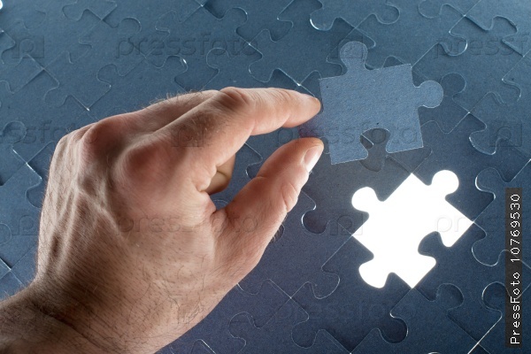 Missing jigsaw puzzle piece for completing the final puzzle piece, stock photo