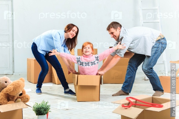 The happy family at repair and relocation on a background of boxes, stock photo