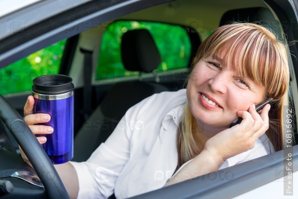 Happy relaxed driver behind the wheel of a car, stock photo