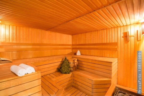 Spacious interior of empty wooden a steam room, stock photo