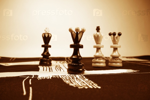 chess pieces on the fabric sepia