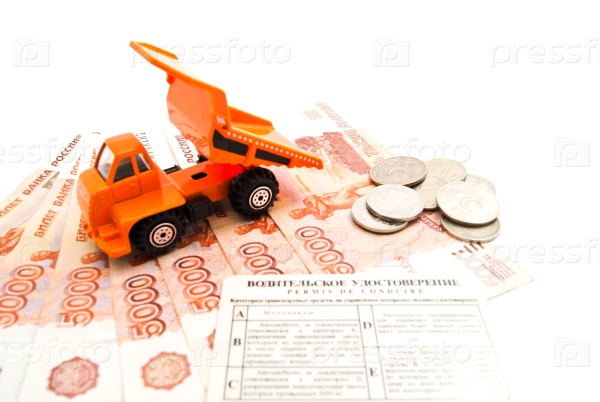 Truck, driving license and banknotes on white closeup, stock photo
