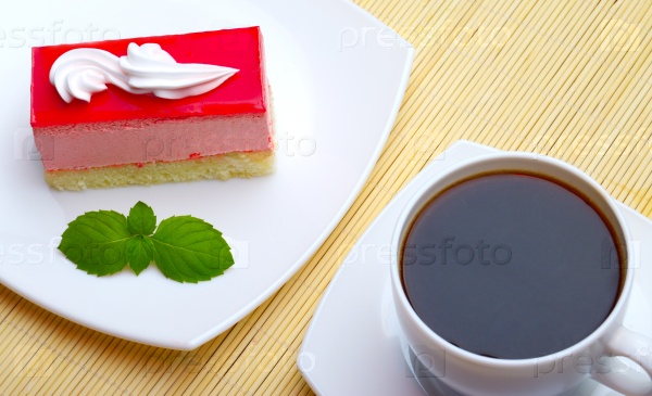 cup of coffee and cake with mint leaf