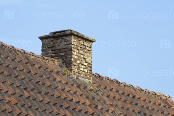 Chimney on a roof of an old residential house