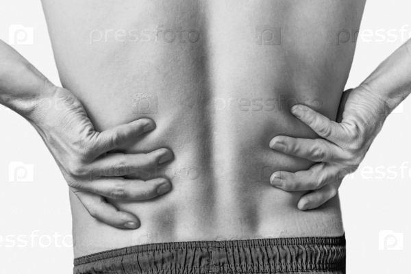 Acute pain in a male lower back. Monochrome image, isolated on a white background, stock photo
