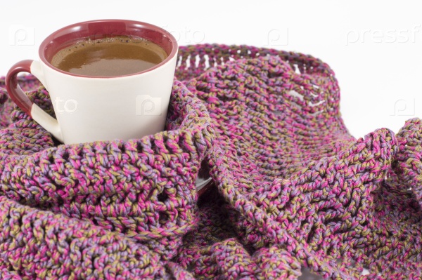 Cup of coffee wrapped in winter scarf, Winter coffee time