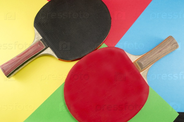 Pair of table tennis rackets on a collage background