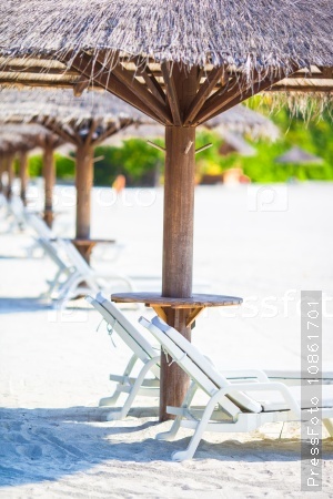 Beach wooden chairs for vacations on tropical beach