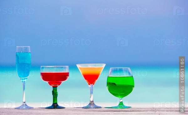 Colorful exotic tasty cocktails background turquoise sea, stock photo