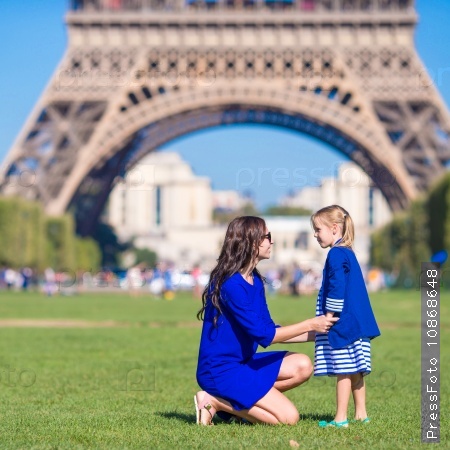 French summer holidays, travel and people concept - happy family in Paris background Eiffel Tower