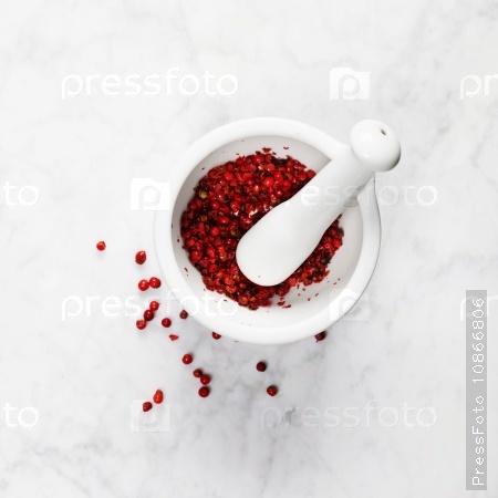 Mortar and pestle with red peppercorns
