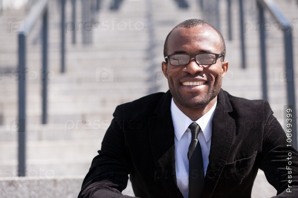 portrait of sitting employee black man