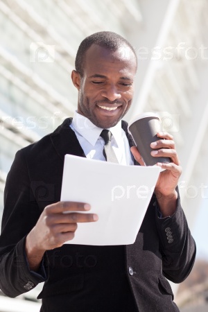 black businessman drinking coffee during a lunch