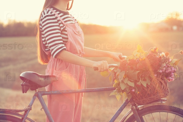 Old bike and basket of flowers