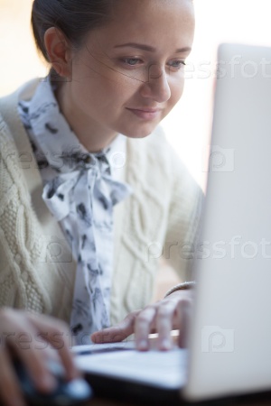 Closeup of woman face and screen