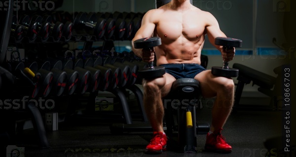 Attractive muscular man sweating and looking tired, stock photo