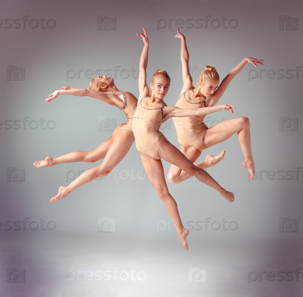 The young beautiful ballerina dancer jumping on a gray background. Collage, stock photo