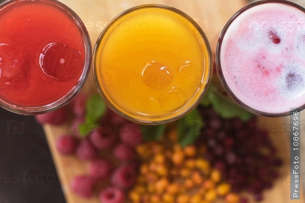 Set of fruit non-alcoholic drink with cranberries raspberries and sea buckthorn, stock photo