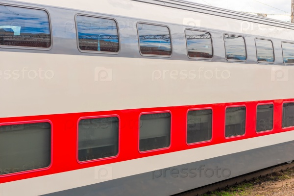 A two-story long-distance passenger train closeup , stock photo