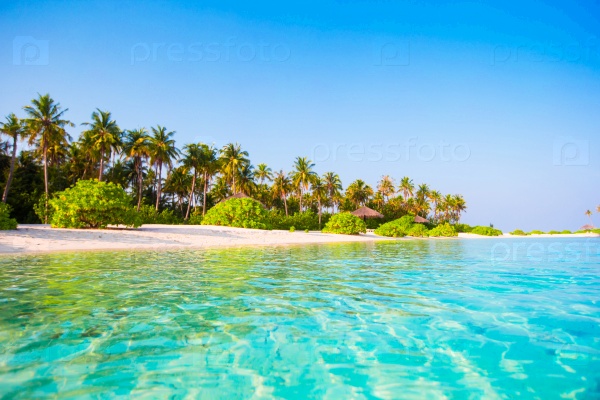 Idyllic clean perfect turquoise water and white sand at exotic island, stock photo