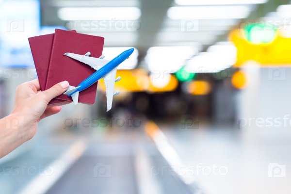 Closeup passports and boarding pass at airport indoor