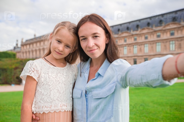Happy family making selfie in Paris on french vacation, stock photo