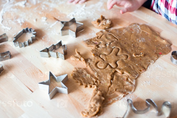 Christmas gingerbread cookies and molds for baking on Xmas eve, stock photo