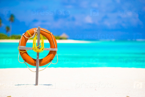 Lifebuoy ring on tropical beach background the sea, stock photo