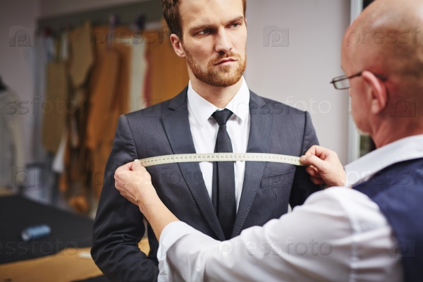 Businessman visiting tailor