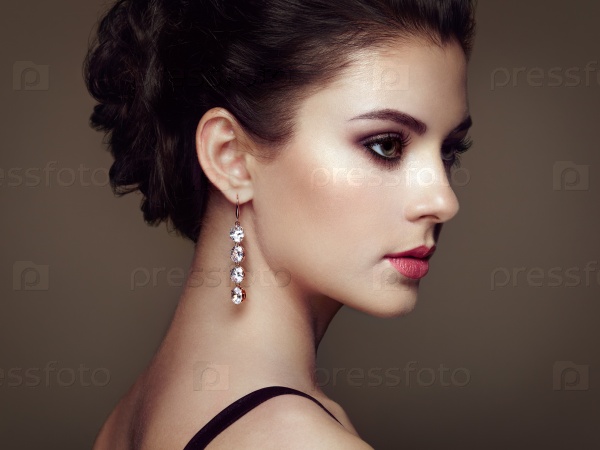 Fashion portrait of young beautiful woman with jewelry. Brunette girl. Perfect make-up. Beauty style woman with diamond accessories, stock photo